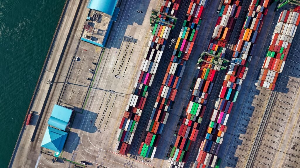 pexels photo 1427107 1427107 Top view of colorful shipping containers at a bustling port in Jakarta, Indonesia.